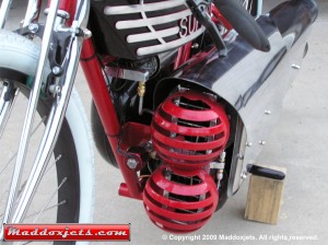 Red Super Twin bike with pulse jets and intake valves reed cage